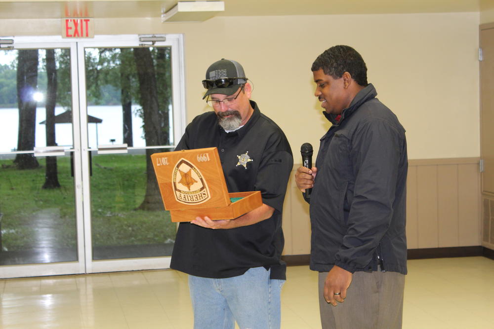 From left-Capt. John McNeil-Maj. Lafayette Woods Jr. presenting Capt. McNeil with service weapon as retireee.JPG