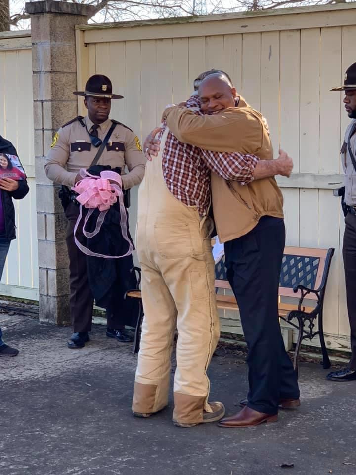 Sheriff Robinson embraces Jimmy Lake.jpg