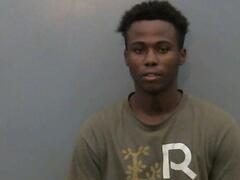 Mugshot of May, Arnett
